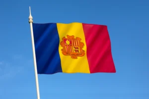 A imagem mostra a bandeira de Andorra, hasteada. Ilustra o texto sobre Acordo de Previdência Social Andorra.